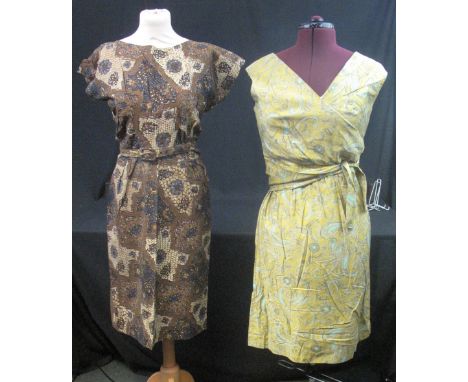 Five vintage printed dresses (50's-60's) to include: brown belted cotton African print dress, yellow dress with printed folia