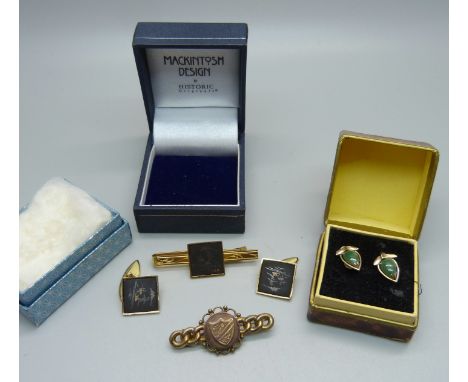 A pair of jade set earrings, the fasteners marked 14k, a tie pin marked K24 and cufflinks set and a brooch 