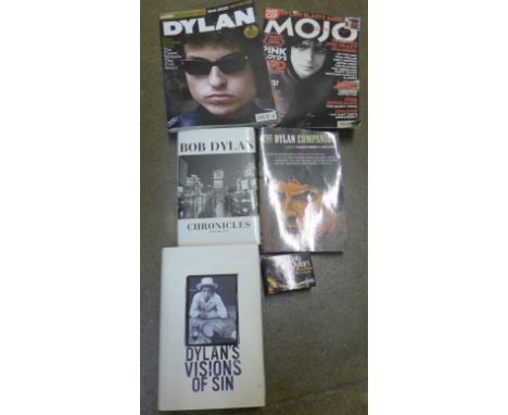 A collection of Bob Dylan books, newspaper cuttings and calendar 
