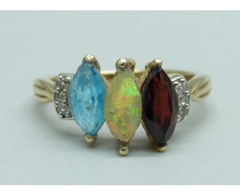 A 9ct gold and multi-gem set ring including Ethiopian opal, 2.2g, M, centre stone a/f 