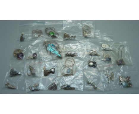 A collection of silver pendants and chains 