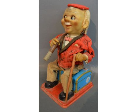 A Japanese Tin Plate Automaton 'Smokey McGregor' circa 1960, 28 cms tall