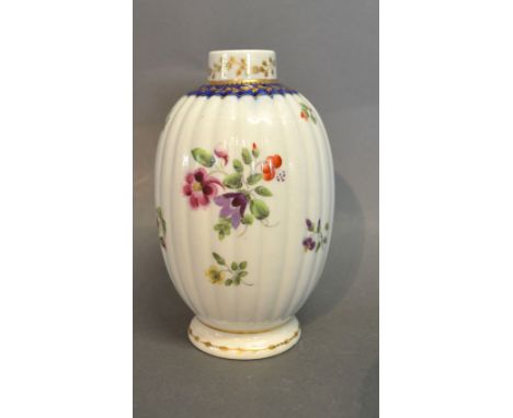 A First Period Worcester Tea Canister of Ribbed Oviform, decorated with foliate sprigs and highlighted with gilt, circa 1770,