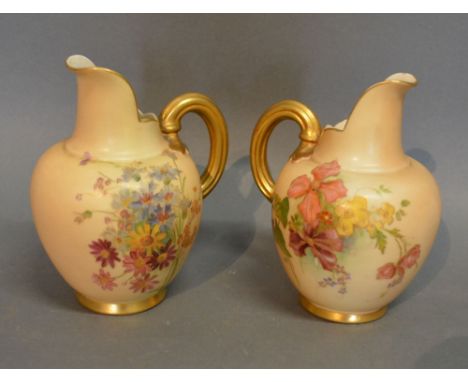 A Pair of Royal Worcester Blush Ivory Jug Vases, each hand painted with summer flowers and highlighted with gilt, each number