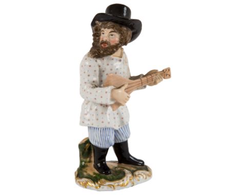  A RUSSIAN PORCELAIN FIGURE OF A PEASANT MAN PLAYING A BALALAIKA, KORNILOV BROTHERS PORCELAIN FACTORY, SAINT PETERSBURG, 1840