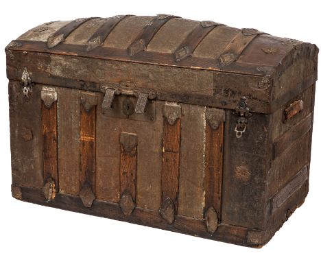  AN ANTIQUE STEAMER TRUNK, 1870-1910  Of rectangular shape with a hinged dome cover, with plates of embossed sheet metal feat