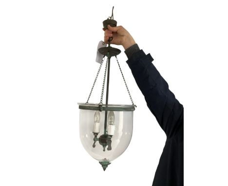 A good contemporary ceiling light - as a  bell jar hanging lantern, with green verde gris style iron work and glass bell base