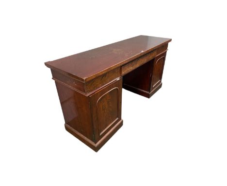 A good William IV mahogany sideboard with three drawers to the top, on pedestal supports opening to reveal two slides with cu