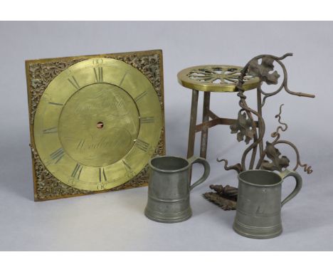 An antique brass longcase clock dial signed: “Jam Smyth Woodbridge”, 11¾” wide; together with a brass trivet; a wrought-iron 