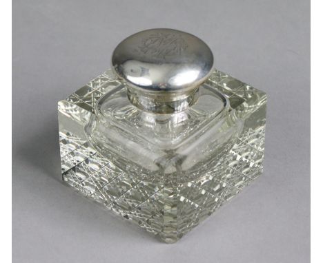 An Edwardian square glass silver-mounted inkwell with canted corners &amp; hobnail base, the hinged silver lid with removable