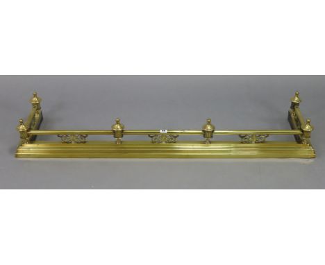 A brass fender, 54” long; &amp; two vintage warming pans, each with long turned wooden handle.