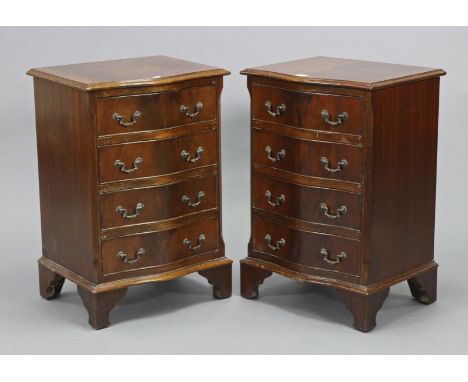 A pair of reproduction mahogany serpentine-front four-drawer bedside chests, on bracket feet, 19” wide x 28” high x 15½” deep