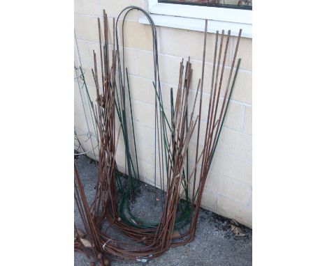A large quantity of vintage iron garden tree/shrub supports.