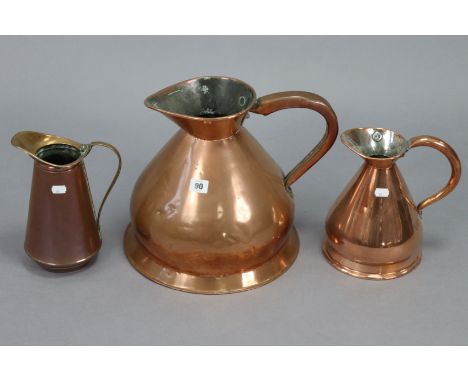 Two vintage copper measures, 11½” &amp; 9½” high; &amp; a copper ewer, 9¾” high.