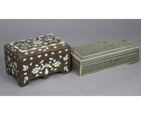 An eastern hardwood trinket box with all-over mother-of-pearl &amp; bone inlaid decoration, &amp; with a fitted interior encl