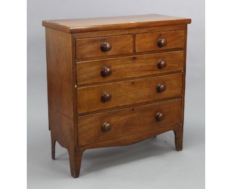 A Victorian mahogany small chest fitted two short &amp; three long graduated drawers with turned knob handles, &amp; on ogee 