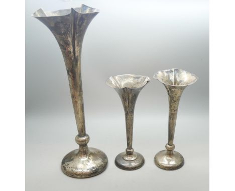 Three silver trumpet shaped vases, tallest 25cm, 465g total weight