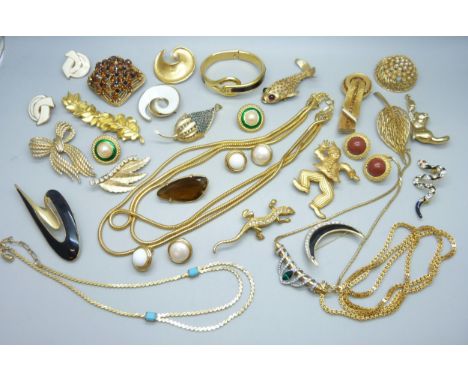 A collection  of gold tone vintage costume jewellery including Sphinx and Crown Trifari 