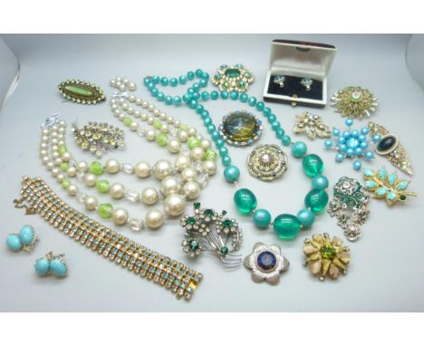 A collection of vintage costume jewellery including brooches and necklaces 