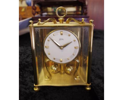 German Kuma brass & glass mantle clock unused with key, 18cm high approx.