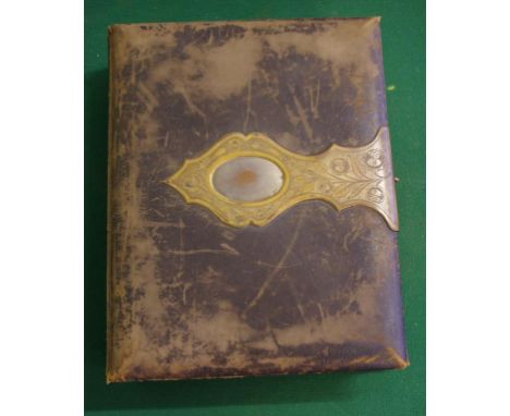 Victorian leather bound photo album partially filled with portrait photographs