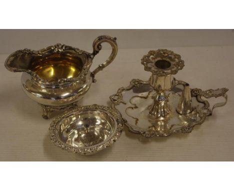 Antique silver plated chamber stick together with an antique silver plate jug & strainer