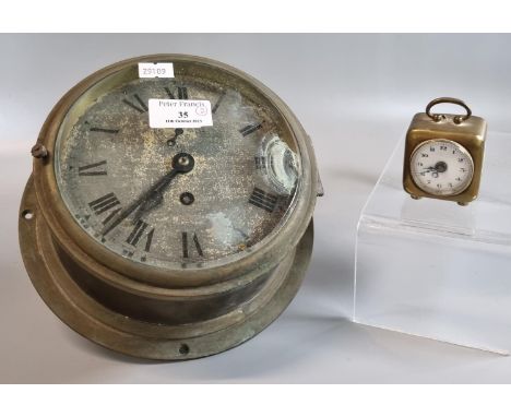 Early 20th century brass single train bulkhead ship's type clock together with small brass and enamel carriage clock.  (2)  (