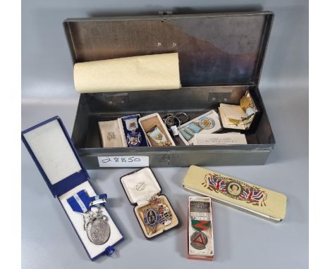 Strong box containing an assortment of Masonic Jewells to include: Coradog Lodge 1876 and others, particularly silver gilt an