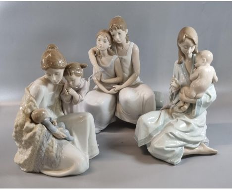 Three Lladro Spanish porcelain figure groups to include: Mother holding baby with child 6939, two lovers on a seat and 'Sleep