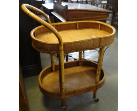 Oak old charm style freestanding cabinet with an arrangement of three drawers on bracket feet. Together with an Art Deco bow 