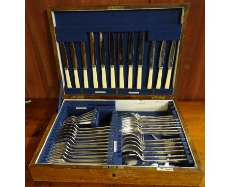 Early 20th century oak cased canteen of silver plated cutlery by Walker &amp; Hall.  (B.P. 21% + VAT) 