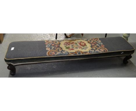 Victorian footstool of low proportions on stained wooden cabriole legs and scroll feet with floral tapestry top.  122cm lengt