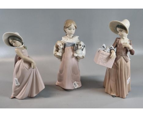 Three Lladro Spanish porcelain figurines to include: 'Chiquitina Pose Iris' 06276, 'Gone Shopping' 06488 and 'Arms Full of Lo