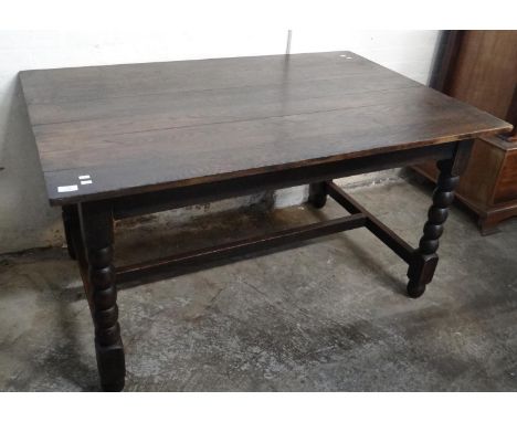 Mid century oak dining table with centre stretcher and bobbin turned legs. 138x91x76cm approx. (B.P. 21% + VAT)  Shrinkage, s