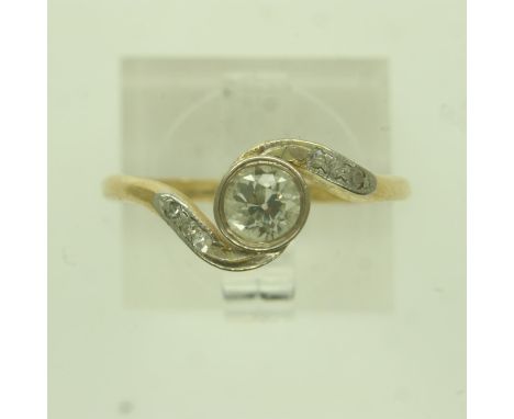 18ct gold solitaire diamond-set ring, the stone of approximately 0.3cts flanked by diamond-set shoulders in a crossover setti
