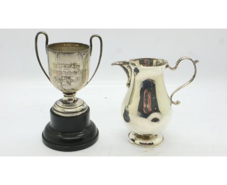 Hallmarked silver cream jug and a miniature silver trophy, combined 117g. UK P&amp;P Group 1 (£16+VAT for the first lot and £