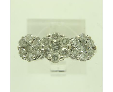 14ct white gold diamond set triple cluster ring, the centre cluster is set with seven round brilliant cut diamonds, the centr