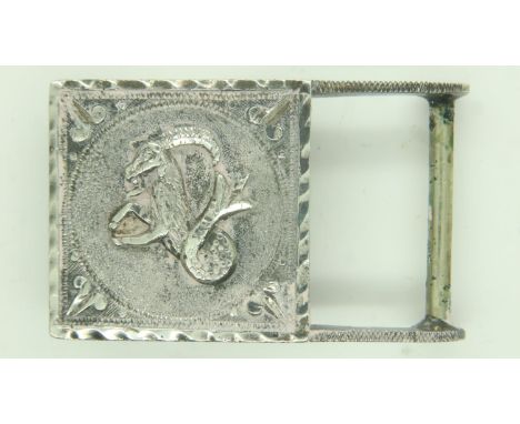 A white metal buckle, decorated in relief with an image of Aries, stamped verso (indistinct). UK P&amp;P Group 0 (£6+VAT for 