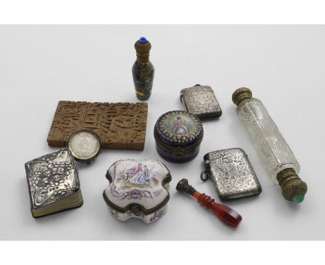 A COLLECTION OF OBJECTS OF VERTU: Including two silver vestas, Birmingham 1902/04, a florin brooch 1887, two scent bottles, a