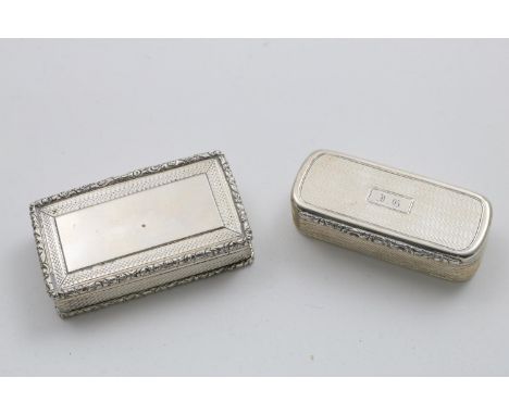 A WILLIAM IV RECTANGULAR SNUFF BOX with raised floral borders, reeded sides and a vacant cartouche on the cover, gilt interio
