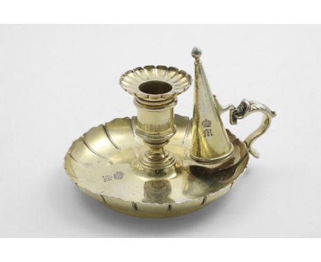 A GEORGE IV SILVERGILT CHAMBERSTICK with a dished circular base, a scalloped border with fluting, a conical snuffer and a det