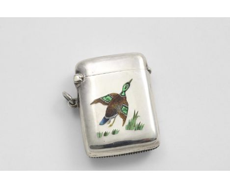 AN EDWARDIAN VESTA CASE of plain rounded oblong form, enamelled in polychrome with a mallard drake, springing up from a patch