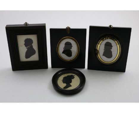 FOUR SILHOUETTE PORTRAITS Including two Regency silhouettes on plaster, each a portrait of a gentleman (8.5 x 6cms), another 
