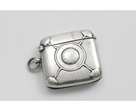AN EDWARDIAN ARTS &amp; CRAFTS VESTA CASE with a stamped circular cartouche and four radiating tree-like motifs, lightly hamm