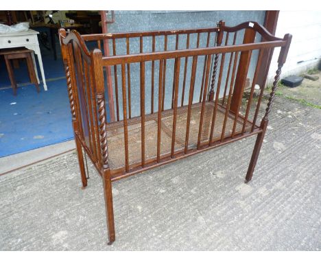 A fold-up vintage child's cot (no mattress).