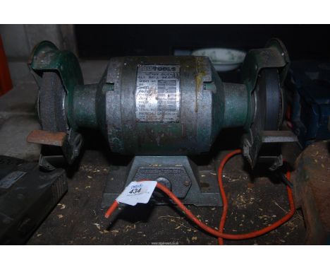 A 'Nutool' 6" bench grinder and a 'Black & Decker' electric drill.