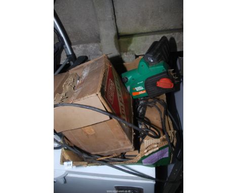 A projector and an electric chainsaw with cutter bar.