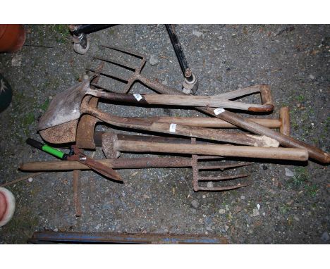A quantity of Garden tools, including - Spades, Forks, and Pickaxe etc.