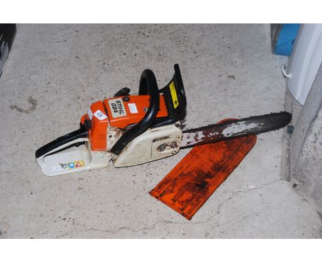 A 'Stihl' 024 Chainsaw with chain brake - (working at time of lotting).