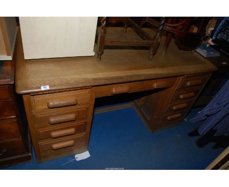 A military style light oak desk - 5' x 34" x 30" high.